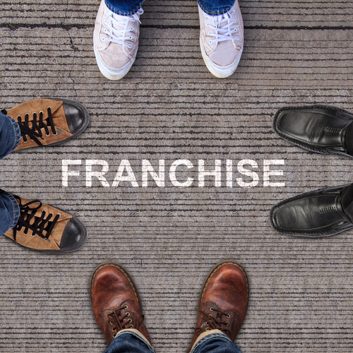 four pairs of shoes with franchise